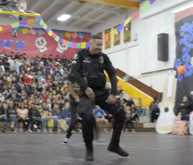 Officer takes the floor with students and shows off moves that earn over 20M views