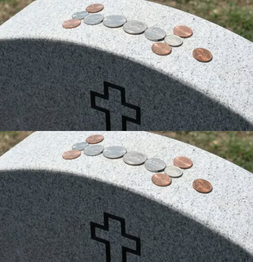 What do coins on military tombstones mean?